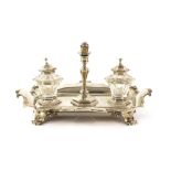 Victorian silver desk stand, with two silver-mounted inkwells and a taper stick, engraved with
