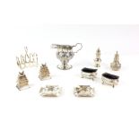Small group of silver items to include an Edward VII silver cream jug, embossed with foliage and