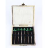 Novelty cased set of six Art Deco silver cocktail sticks in the form of swords with Green handles by