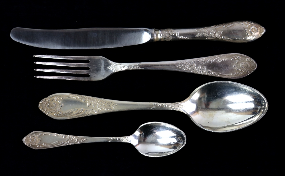 Possibly Russian table-service for twelve place-settings, comprising table knives, forks, spoons,