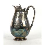 White metal water jug, the bulbus body with foliate decoration, 22cm high