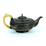 George IV teapot of globular form with fluted upper body above a band of leaves , ivory handle