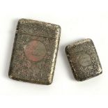 A Victorian silver card case profusely engraved with flowers and scroll work London 1883 makers