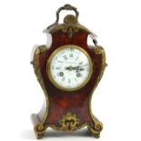 Faux tortoiseshell and ormolu mounted mantle clock, the white enamel dial with Roman and Arabic