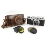 Leica III SLR 35mm camera No, 306570 with a Summar f=5cm 1:2 lens No 69602, original brown leather