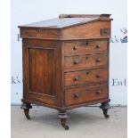 19th century rosewood Davenport with sliding top, flap enclosing drawers, with further drawers and