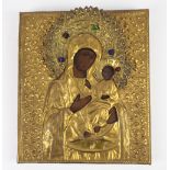 Russian icon of the Mother of God of Iberia with repoussé gilt metal riza and haloes with paste