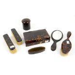 Tortoiseshell part dressing table set comprising dressing box with lined interior, 18cm wide,