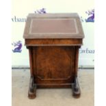 19th century walnut davenport with fitted interior and brass gallery on scroll supports and having