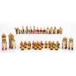 Indian bone and wood chess set, carved as elephants and soldiers, gilt painted, H15.5cm