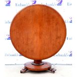 19th century mahogany tilt top round breakfast table on column support and lion's paw feet on