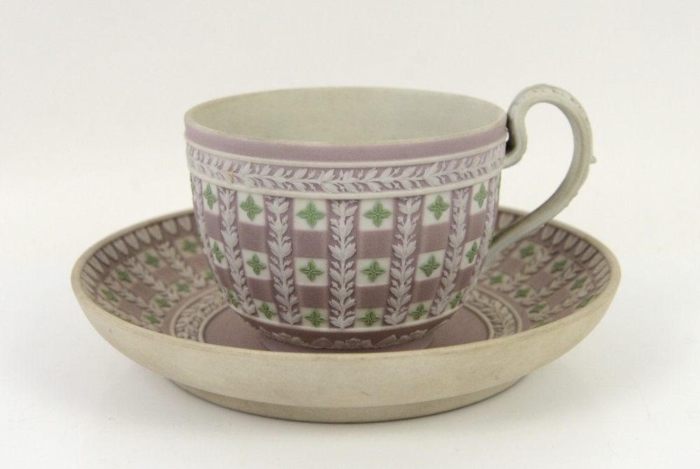 Wedgwood tri-colour Jasper Dip Diceware Cup and Saucer, late 19th century, lilac ground with applied