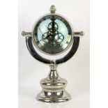 Modern globe form clock on stand, 45cm high,