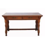 Aesthetic movement mahogany table by Gillow & Co., the rectangular top above two short drawers,