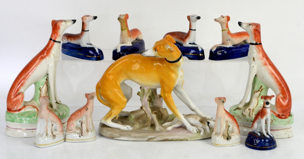 Collection of over 20 Staffordshire dogs and sheep, mainly greyhounds, tallest 27cm high