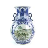 A large Chinese underglaze blue and famille rose decorated vase with flaring, trumpet rim and