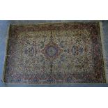 Persian cream ground rug with numerous floral motifs and borders, 216cm x 140cm,