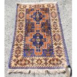 3 Rugs to include a Persian red ground rug with central medallion and stylised floral motifs,