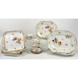 Collection of Dresden porcelain decorated with floral sprays and gilding on a white ground, to