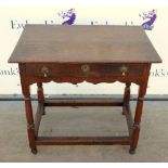 Early 18th century oak side table with a single drawer and turned legs united by peripheral
