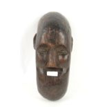 Early 20th century West African carved wooden tribal mask, possibly from the Bambara people, Mali,