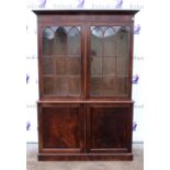 19th Century mahogany bookcase, the top with two glazed doors and adjustable shelves, with two