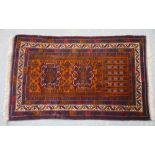 Persian Belouch style rug, double floral medallion on a mustard ground with stylised floral