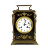 Late 19th/early 20th century French ebonised and cast metal mounted mantel clock, white enamelled