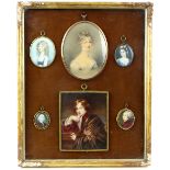 Six portrait miniatures in a gilt frame, one of a young woman, signed Adam Buck and dated 1821, 13cm