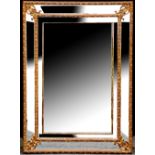 A large gilt mirror of rectangular form with shell decoration, 110cm x 80cm