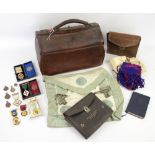 Various Masonic jewels and regalia in leather gladstone type bag.