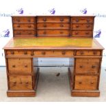 Early 19th Century mahogany pedestal writing desk with breakfront galleried top with 9 graduated