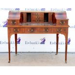 Early 20th century inlaid mahogany Carlton House desk, with an arrangement of drawers above