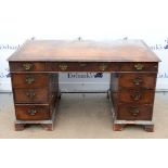 Early 19th century mahogany pedestal writing desk with leather top, two short and one long drawer,