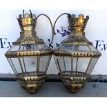 Pair of pierced metal and glass ceiling lights, 42cm high