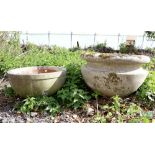 Large composite stone garden planter, H48cm Diameter 73cm, together with a smaller example, H28cm