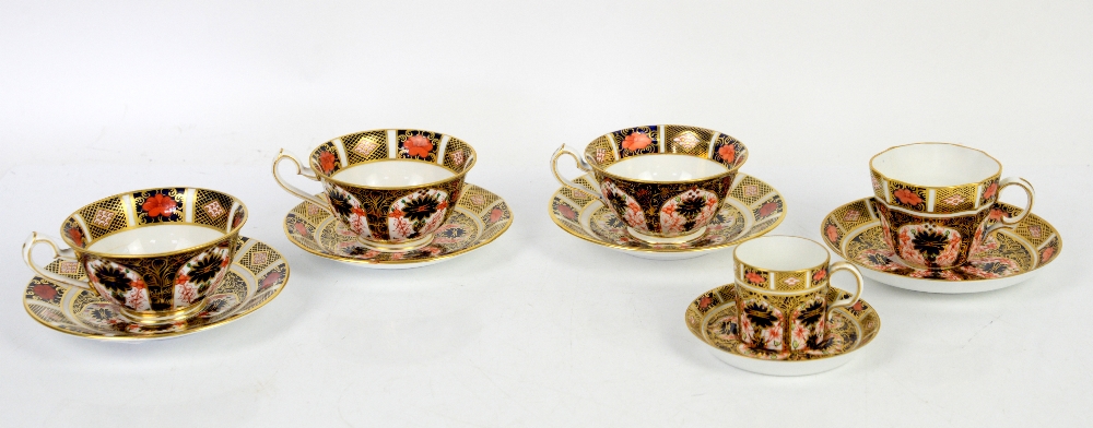 Royal Crown Derby Imari pattern no 1128, four cups and saucers, and a coffee can and saucer