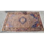 Persian style pink ground carpet, central diamond medallion on a pink ground with stylised floral