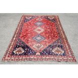 Persian rug with five pole medallion and repeating bird and floral motifs within bands with floral