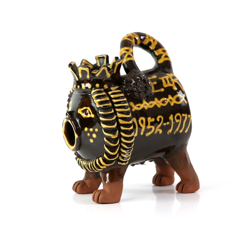 Mary Wondrausch slip decorated pottery lion, 'The Silver Jubilee' to one side and 'E II R 1952-1977'