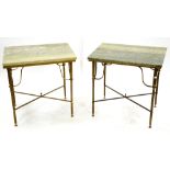 In the manner of Maison Jansen, Paris, a pair of green marble top tables on gilt metal reeded legs