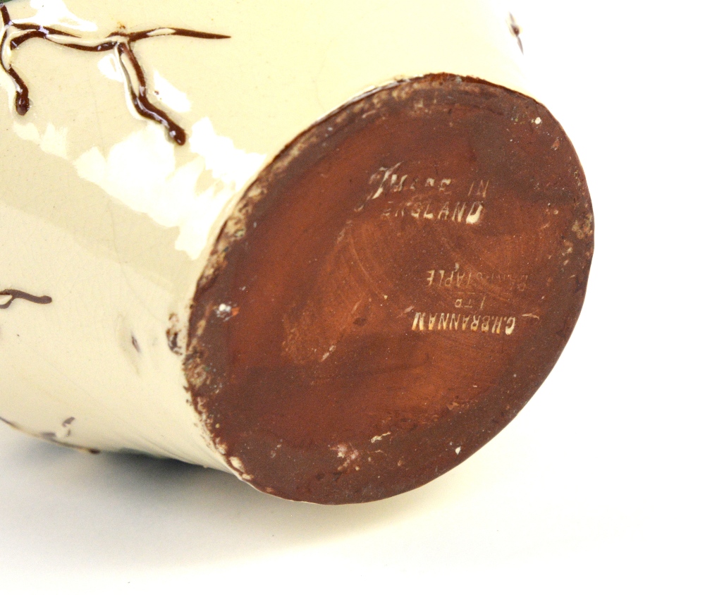 C H Brannam, Barnstaple studio pottery jug with green leaves and brown berries decoration on a cream - Image 7 of 10