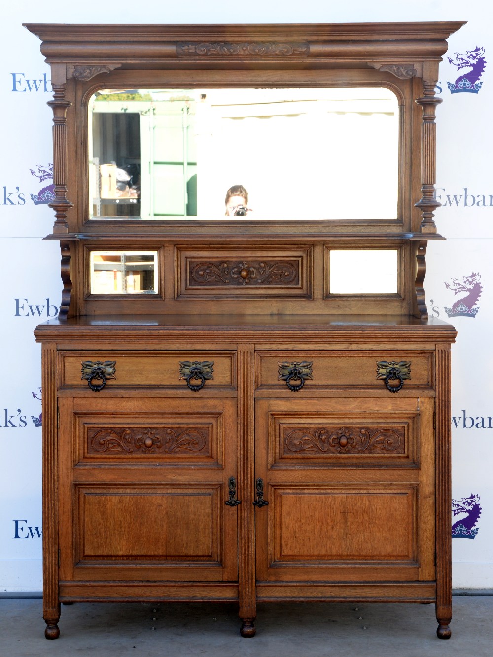 Arts and Crafts / Art Nouveau oak dresser with mirrored back on bun feet, w146 x d54, height base