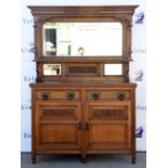 Arts and Crafts / Art Nouveau oak dresser with mirrored back on bun feet, w146 x d54, height base