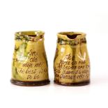 Mary Wondrausch slip decorated pottery pinched spout jugs, one 'Grow old with me The best is yet