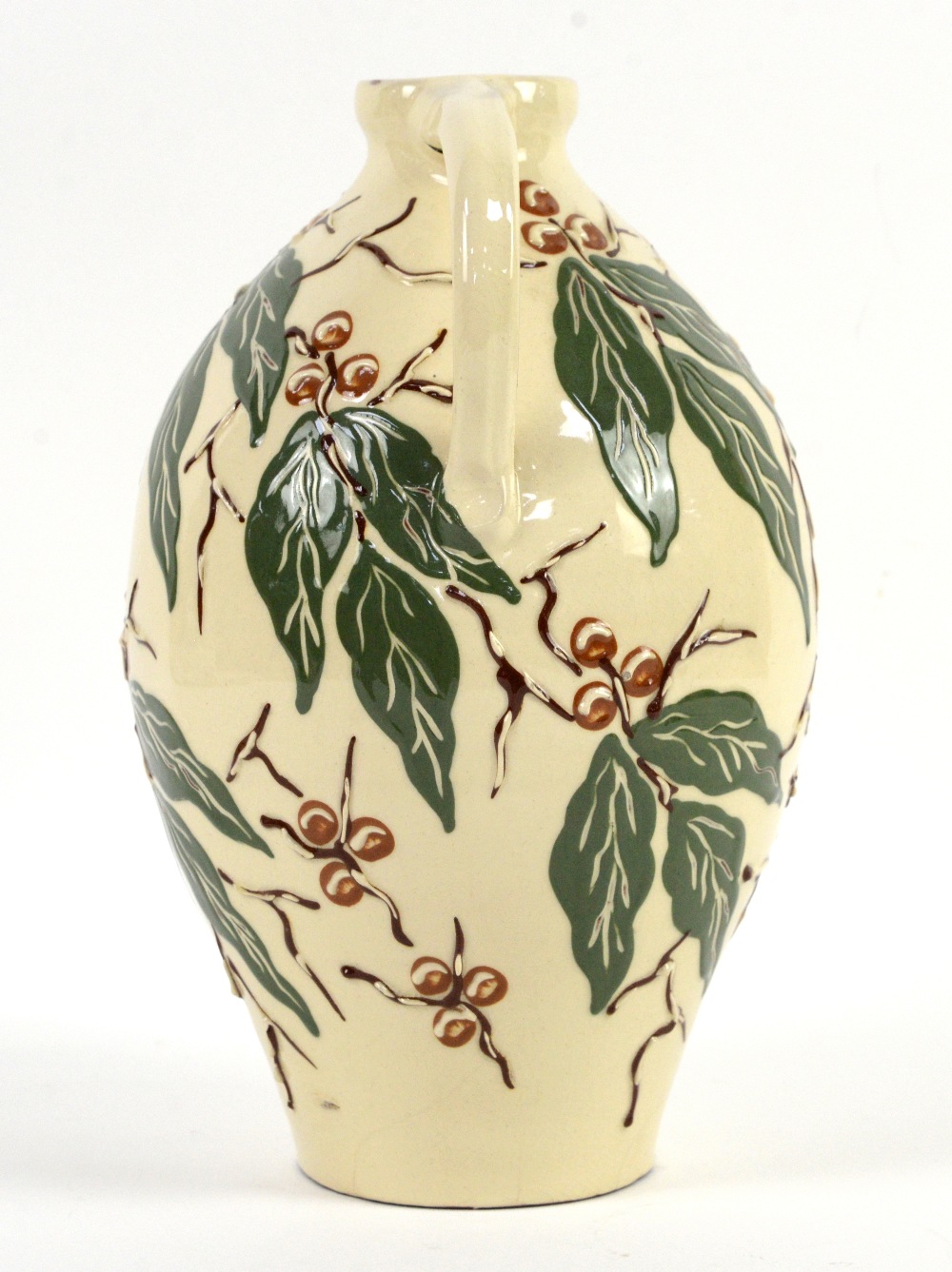 C H Brannam, Barnstaple studio pottery jug with green leaves and brown berries decoration on a cream - Image 3 of 10