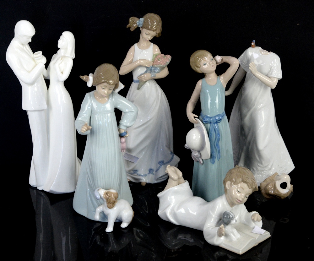 Llladro figure of a girl holding her bonnet and three Nao figures of children and Doulton figure