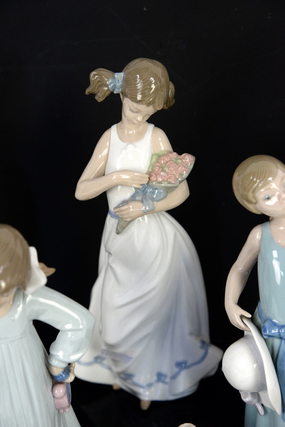 Llladro figure of a girl holding her bonnet and three Nao figures of children and Doulton figure - Image 4 of 6