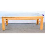 Modern bamboo framed glass topped coffee table. 122W x 42H x 61D