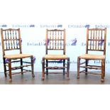 Set of eight 19th century oak dining chairs with rush seats and stretchered base on shaped feet.